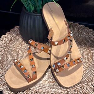 Brown slip on sandals with gold studs